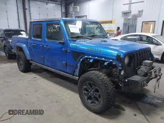 2021 Jeep Gladiator Willys с VIN 1C6HJTAG9ML535479, выставлен на аукционе IAAI как лот 41212241 с пробегом 81 044 миль миль и . История ставок и продаж доступна на DreamBid. Изображение 1.