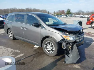 2012 Honda Odyssey EX-L with VIN 5FNRL5H63CB048912, listed as a IAAI auction lot 42050711 with 130,262 mi miles and . Bid and sale history available at DreamBid. Image 1.