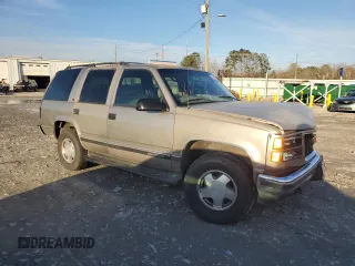 1999 GMC Yukon with VIN 1GKEK13R3XJ785249, listed as a Copart auction lot 42825185 with 351,225 mi miles and Salvage Title. Bid and sale history available at carsss.com. Image 4.