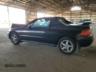 1997 Honda del Sol Si with VIN JHMEH6265VS005885, listed as a Copart auction lot 43037075 with 86,665 mi miles and Salvage Title. Bid and sale history available at carsss.com. Image 2.