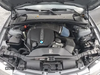 2012 BMW 1 Series 135i with VIN WBAUN7C59CVM26082, listed as a Copart auction lot 74711754 with 77,152 mi miles and Salvage title. Bid and sale history available at DreamBid. Image 11.