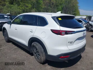 2021 Mazda CX-9 Touring z VIN JM3TCBCYXM0521323, wystawiony jako IAAI lot #42190976 z przebiegiem 56 652 mil mil oraz . Historia ofert i sprzedaży dostępna na DreamBid. Obrazek 3.