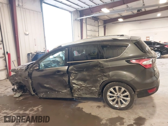 2017 Ford Escape Titanium with VIN 1FMCU9JD7HUE46427, listed as a IAAI auction lot 41808083 with 55,201 mi miles. Bid and sale history available at carsss.com. Image 15.