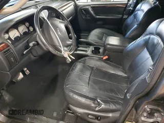 2004 Jeep Grand Cherokee Limited with VIN 1J8GX58N84C330702, listed as a Copart auction lot 84808454 with 164,426 mi miles and Salvage Title. Bid and sale history available at DreamBid. Image 7.