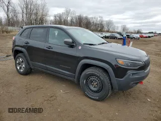2019 Jeep Cherokee Trailhawk with VIN 1C4PJMBX7KD341534, listed as a Copart auction lot 52352765 with 207,532 mi miles and Salvage Title. Bid and sale history available at DreamBid. Image 4.