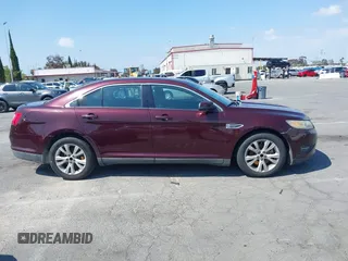 2011 Ford Taurus SEL with VIN 1FAHP2EW8BG137937, listed as a IAAI auction lot 42107586 with 143,525 mi miles. Bid and sale history available at carsss.com. Image 14.