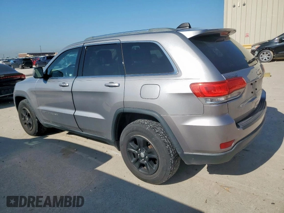 2014 Jeep Grand Cherokee Laredo with VIN 1C4RJEAG4EC182773, listed as a Copart auction lot 54085255 with 138,775 mi miles and Salvage Title. Bid and sale history available at DreamBid. Image 2.