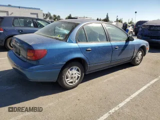 2001 Saturn SL z VIN 1G8ZF52861Z275529, wystawiony jako Copart lot #74153154 z przebiegiem 171 272 mil mil oraz Tytuł czysty. Historia ofert i sprzedaży dostępna na DreamBid. Obrazek 3.