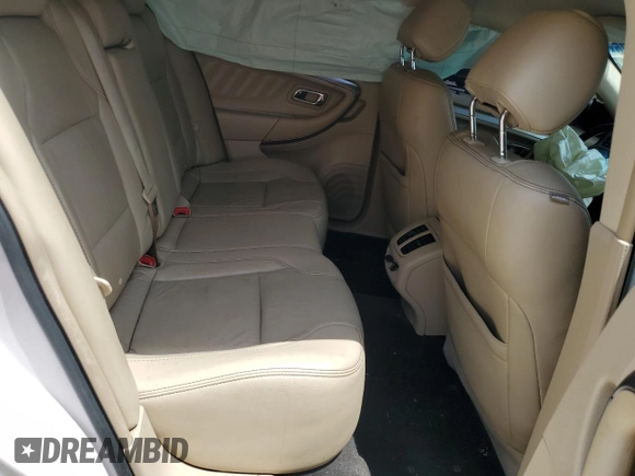 2016 Ford Taurus SEL z VIN 1FAHP2E86GG138691, wystawiony jako Copart lot #57495575 z przebiegiem Nie podano mil oraz Szkoda całkowita • Salvage title. Historia ofert i sprzedaży dostępna na DreamBid. Obrazek 10.