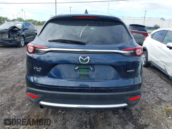 2021 Mazda CX-9 Grand Touring with VIN JM3TCBDY3M0537975, listed as a IAAI auction lot 42251894 with 50,156 mi miles and . Bid and sale history available at DreamBid. Image 16.