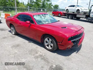 2016 Dodge Challenger SXT z VIN 2C3CDZAG3GH311787, wystawiony jako IAAI lot #42700580 z przebiegiem 168 808 mil mil oraz . Historia ofert i sprzedaży dostępna na DreamBid. Obrazek 1.