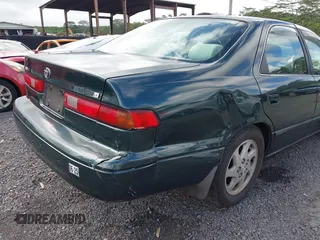 1999 Toyota Camry LE z VIN JT2BF22K2X0164080, wystawiony jako IAAI lot #40984874 z przebiegiem Nie podano mil oraz . Historia ofert i sprzedaży dostępna na DreamBid. Obrazek 13.