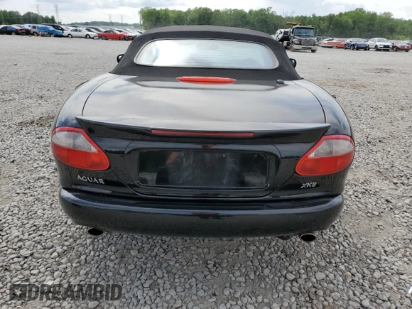 1999 Jaguar XK z VIN SAJGX2044XC031383, wystawiony jako Copart lot #54726925 z przebiegiem 107 696 mil mil oraz Szkody całkowita. Historia ofert i sprzedaży dostępna na DreamBid. Obrazek 6.