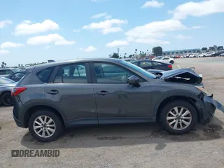 2014 Mazda CX-5 Sport with VIN JM3KE2BE0E0411377, listed as a IAAI auction lot 42143229 with 137,384 mi miles and . Bid and sale history available at carsss.com. Image 13.