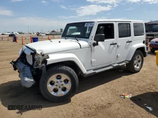 2014 Jeep Wrangler Unlimited Sahara with VIN 1C4BJWEG1EL210949, listed as a Copart auction lot 60977555 with 122,495 mi miles and Salvage title. Bid and sale history available at DreamBid. Image 1.