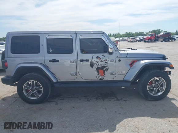 2018 Jeep Wrangler Unlimited Sahara with VIN 1C4HJXEG4JW115522, listed as a IAAI auction lot 42322791 with 68,409 mi miles and . Bid and sale history available at DreamBid. Image 13.