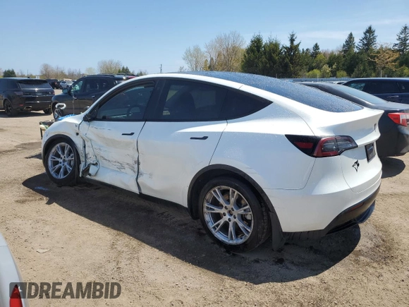2023 Tesla Model Y Long Range z VIN 7SAYGDEE3PF772663, wystawiony jako Copart lot #56470455 z przebiegiem 50 705 mil mil oraz Czysty tytuł • Clean title. Historia ofert i sprzedaży dostępna na DreamBid. Obrazek 2.