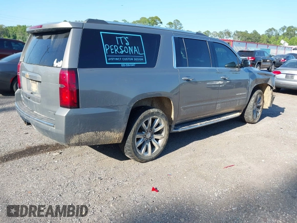 2019 Chevrolet Suburban LT with VIN 1GNSCJKC3KR129739, listed as a IAAI auction lot 42044708 with 105,771 mi miles and . Bid and sale history available at DreamBid. Image 4.