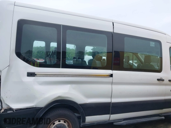 2016 Ford Transit Passenger XL z VIN 1FBZX2CM2GKB51339, wystawiony jako IAAI lot #41429005 z przebiegiem 215 896 mil mil oraz . Historia ofert i sprzedaży dostępna na DreamBid. Obrazek 13.