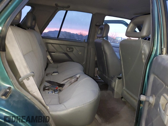 1996 Isuzu Rodeo z VIN 4S2CK58E1T4331031, wystawiony jako Copart lot #78573514 z przebiegiem 218 994 mil mil oraz Szkody całkowita. Historia ofert i sprzedaży dostępna na DreamBid. Obrazek 11.