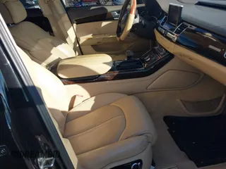 2015 Audi A8 L 4.0T with VIN WAU32AFD4FN014063, listed as a IAAI auction lot 41501970 with 158,570 mi miles. Bid and sale history available at carsss.com. Image 5.