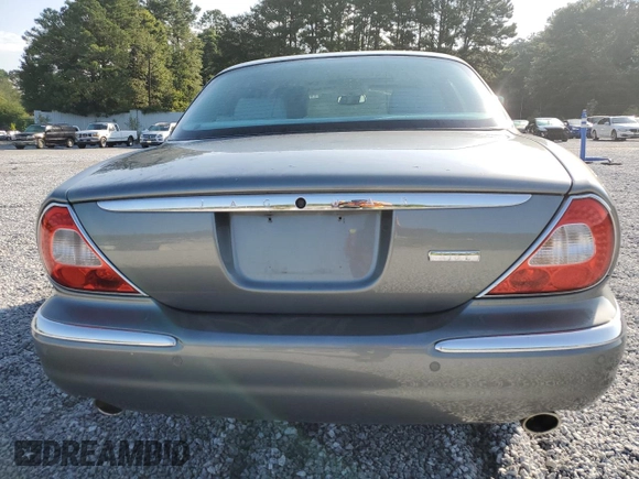 2005 Jaguar XJ with VIN SAJWA79C65SG45989, listed as a Copart auction lot 65357044 with 103,587 mi miles and Salvage Title. Bid and sale history available at carsss.com. Image 6.