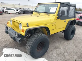 2000 Jeep Wrangler Sport with VIN 1J4FA49S0YP781831, listed as a IAAI auction lot 41694680 with 250,108 mi miles and . Bid and sale history available at DreamBid. Image 2.