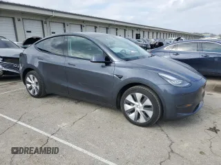 2023 Tesla Model Y Long Range with VIN 7SAYGDEE2PA024693, listed as a Copart auction lot 52595935 with 35,179 mi miles and Salvage Title. Bid and sale history available at DreamBid. Image 4.