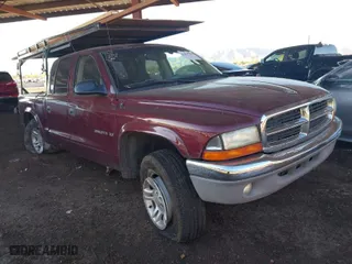 2002 Dodge Dakota SLT with VIN 1B7HG48N72S697907, listed as a IAAI auction lot 41866346 with 169,120 mi miles. Bid and sale history available at carsss.com. Image 1.