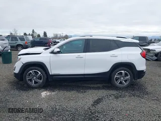 2020 GMC Terrain SLT z VIN 3GKALVEVXLL143417, wystawiony jako IAAI lot #41714662 z przebiegiem 97 634 mil mil oraz . Historia ofert i sprzedaży dostępna na DreamBid. Obrazek 14.