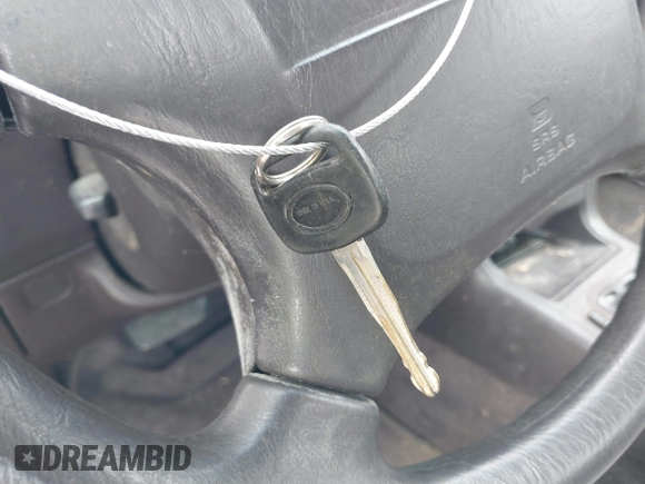 1994 Toyota Camry LE z VIN 4T1SK12E0RU463582, wystawiony jako IAAI lot #41823733 z przebiegiem 120 050 mil mil oraz . Historia ofert i sprzedaży dostępna na DreamBid. Obrazek 11.