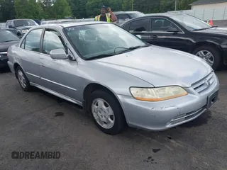 2002 Honda Accord EX z VIN 1HGCG165X2A077751, wystawiony jako IAAI lot #42262698 z przebiegiem Nie podano mil oraz . Historia ofert i sprzedaży dostępna na DreamBid. Obrazek 1.