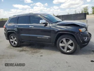 2014 Jeep Grand Cherokee Overland with VIN 1C4RJECG9EC173693, listed as a Copart auction lot 53747045 with 73,234 mi miles and Non Repairable. Bid and sale history available at carsss.com. Image 4.