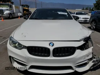2015 BMW M4 with VIN WBS3R9C51FK334414, listed as a Copart auction lot 52451035 with 122,436 mi miles and Salvage title. Bid and sale history available at DreamBid. Image 5.