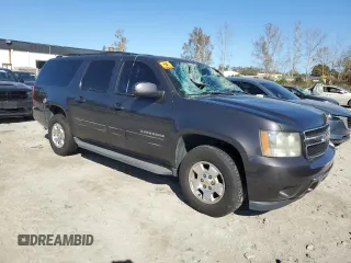 2011 Chevrolet Suburban LS with VIN 1GNSCHE0XBR294973, listed as a Copart auction lot 77258024 with 193,139 mi miles and Salvage Title. Bid and sale history available at carsss.com. Image 4.