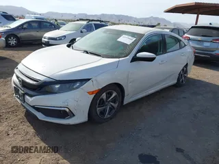 2019 Honda Civic Sedan LX with VIN 2HGFC2F62KH573149, listed as a IAAI auction lot 41575660 with 104,139 mi miles. Bid and sale history available at carsss.com. Image 2.