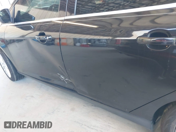 2013 Ford Focus Titanium with VIN 1FADP3J20DL143491, listed as a IAAI auction lot 42034388 with 194,388 mi miles and . Bid and sale history available at carsss.com. Image 6.
