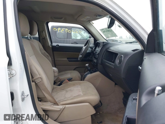 2014 Jeep Patriot Sport with VIN 1C4NJRBB1ED744101, listed as a IAAI auction lot 42009390 with 180,214 mi miles. Bid and sale history available at carsss.com. Image 5.