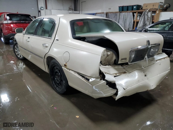 2003 Lincoln Town Car Cartier with VIN 1LNHM83W53Y623587, listed as a Copart auction lot 83599884 with 127,729 mi miles and Salvage Title. Bid and sale history available at carsss.com. Image 2.