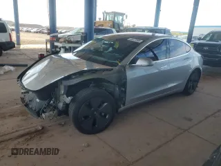 2018 Tesla Model 3 Long Range Battery with VIN 5YJ3E1EA2JF016631, listed as a Copart auction lot 55527095 with 129,547 mi miles and Salvage Title. Bid and sale history available at DreamBid. Image 1.