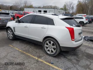 2014 Cadillac SRX Premium Collection z VIN 3GYFNDE34ES548826, wystawiony jako IAAI lot #40792942 z przebiegiem 115 984 mil mil oraz . Historia ofert i sprzedaży dostępna na DreamBid. Obrazek 3.