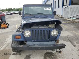 1997 Jeep Wrangler Sport z VIN 1J4FY19S9VP490590, wystawiony jako Copart lot #57492775 z przebiegiem 161 648 mil mil oraz Szkoda całkowita • Salvage title. Historia ofert i sprzedaży dostępna na DreamBid. Obrazek 5.