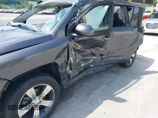 2016 Jeep Compass High Altitude Edition with VIN 1C4NJDEB0GD558230, listed as a IAAI auction lot 39799941 with 57,002 mi miles. Bid and sale history available at carsss.com. Image 15.
