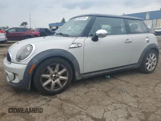 2011 MINI Hardtop S with VIN WMWSV3C58BTY11580, listed as a Copart auction lot 62081615 with 112,336 mi miles and Salvage title. Bid and sale history available at DreamBid. Image 1.