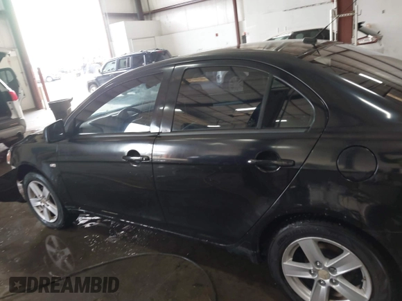 2008 Mitsubishi Lancer DE with VIN JA3AU26UX8U015865, listed as a IAAI auction lot 41108329 with 131,884 mi miles. Bid and sale history available at carsss.com. Image 15.