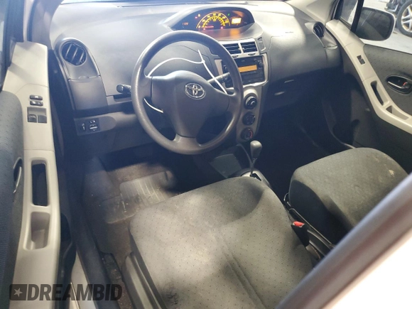 2011 Toyota Yaris with VIN JTDJT4K30B5334173, listed as a Copart auction lot 87031624 with 179,280 mi miles and Salvage Title. Bid and sale history available at carsss.com. Image 8.