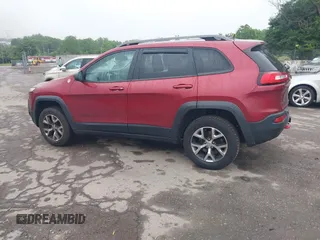 2015 Jeep Cherokee Trailhawk with VIN 1C4PJMBSXFW667469, listed as a IAAI auction lot 42438006 with 127,136 mi miles and . Bid and sale history available at DreamBid. Image 3.