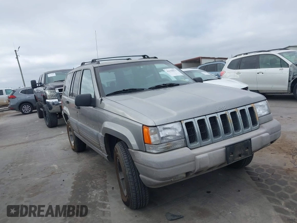 1998 Jeep Grand Cherokee Laredo with VIN 1J4FX58S6WC354101, listed as a IAAI auction lot 42158671 with 289,318 mi miles and . Bid and sale history available at DreamBid. Image 1.