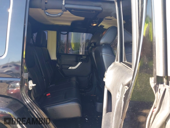 2015 Jeep Wrangler Unlimited Wrangler X with VIN 1C4BJWEG7FL677343, listed as a IAAI auction lot 42147411 with 105,920 mi miles and . Bid and sale history available at DreamBid. Image 8.