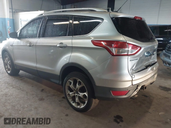 2015 Ford Escape Titanium z VIN 1FMCU9J96FUB23902, wystawiony jako IAAI lot #42497188 z przebiegiem 164 452 mil mil oraz . Historia ofert i sprzedaży dostępna na DreamBid. Obrazek 3.